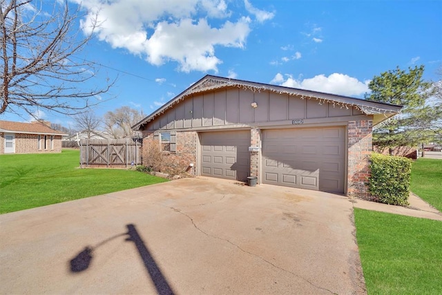 garage with driveway and fence