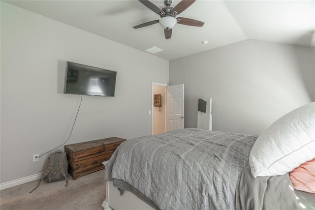 carpeted bedroom with baseboards, a ceiling fan, and vaulted ceiling