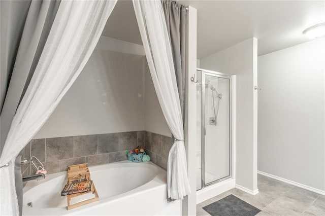 bathroom with a garden tub and a stall shower