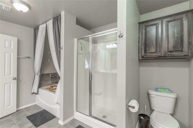 bathroom with tile patterned flooring, a shower stall, toilet, and visible vents