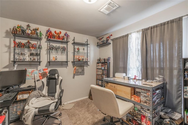 office space featuring carpet, visible vents, and baseboards