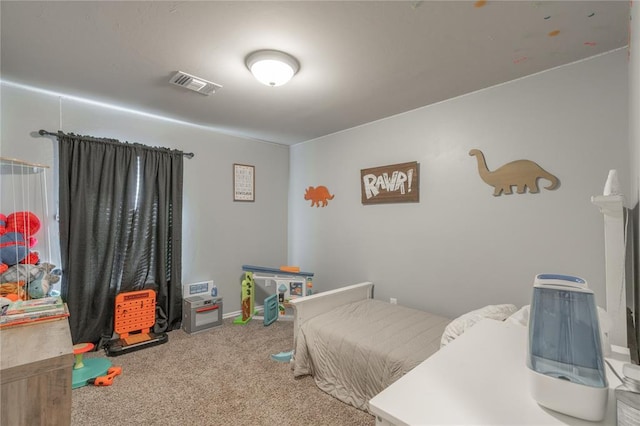 bedroom with visible vents and carpet flooring