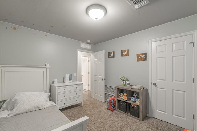 carpeted bedroom with visible vents