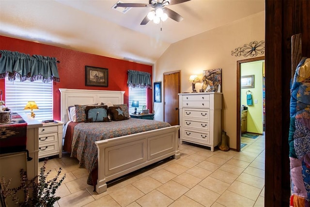 bedroom featuring light tile patterned floors, visible vents, lofted ceiling, and ceiling fan