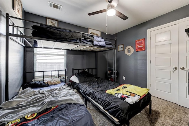 bedroom with a ceiling fan, carpet, and visible vents