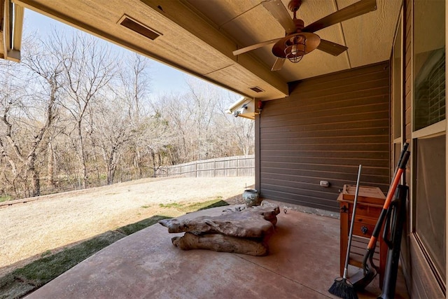 view of patio / terrace featuring visible vents, a ceiling fan, and fence