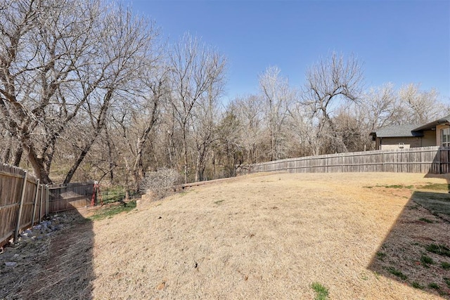 view of yard with a fenced backyard