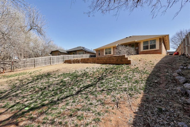 view of yard with a fenced backyard