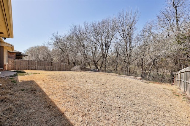 view of yard featuring a fenced backyard