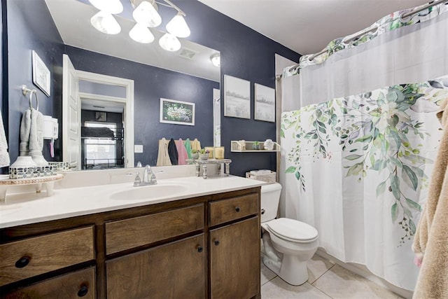 full bath featuring vanity, a shower with curtain, visible vents, tile patterned floors, and toilet