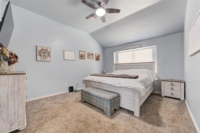 carpeted bedroom with lofted ceiling, a ceiling fan, and baseboards