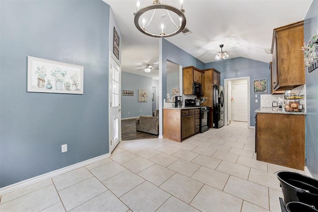 kitchen with visible vents, brown cabinets, black appliances, light tile patterned flooring, and lofted ceiling