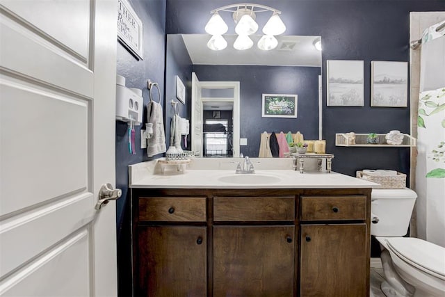 full bath with toilet, a notable chandelier, visible vents, and vanity