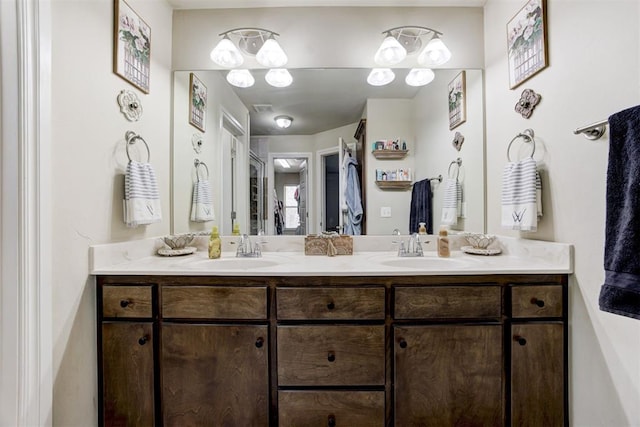 full bath with a sink and double vanity