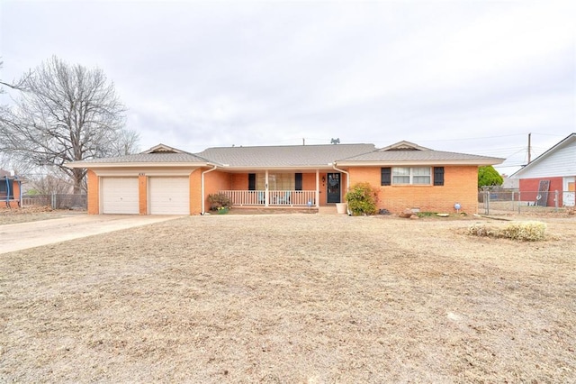 ranch-style home with brick siding, a porch, and fence