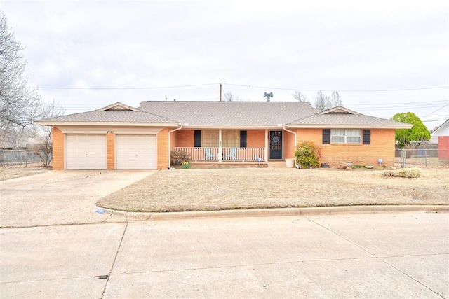 ranch-style house with fence, a porch, an attached garage, concrete driveway, and brick siding