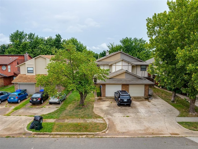 view of front facade featuring brick siding and driveway