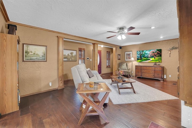 living room with a textured ceiling, crown molding, dark wood-style flooring, and a textured wall