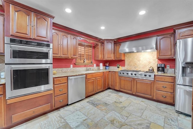 kitchen featuring wall chimney exhaust hood, recessed lighting, tasteful backsplash, and appliances with stainless steel finishes