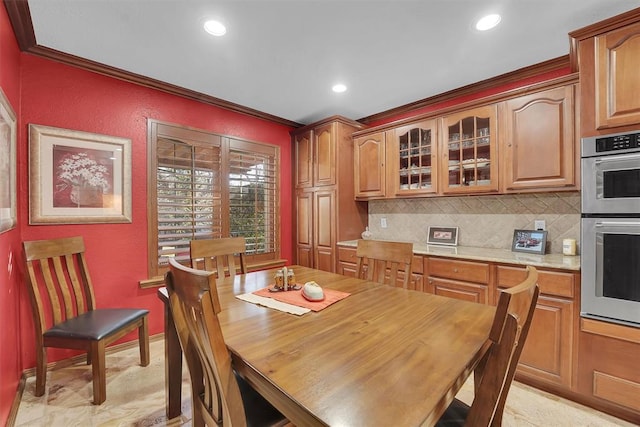 dining space with recessed lighting, baseboards, and ornamental molding