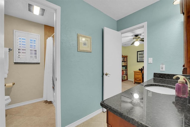 full bath with visible vents, baseboards, toilet, tile patterned floors, and vanity