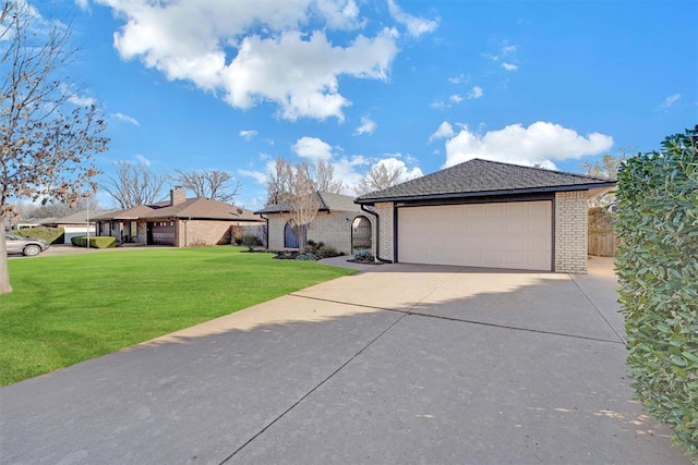 ranch-style house featuring a front yard, fence, driveway, an attached garage, and brick siding