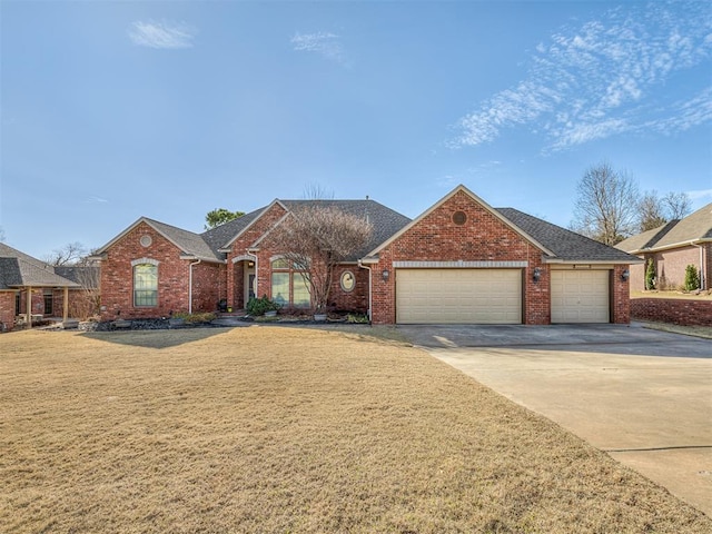 single story home featuring a front yard, brick siding, concrete driveway, and an attached garage