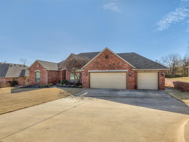 view of front of home featuring a garage, brick siding, driveway, and a shingled roof