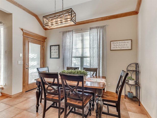 dining space with crown molding, light tile patterned floors, and baseboards