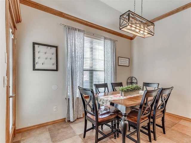 dining area featuring light tile patterned floors, baseboards, a notable chandelier, and ornamental molding