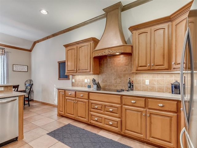 kitchen featuring stainless steel appliances, decorative backsplash, light countertops, custom range hood, and crown molding