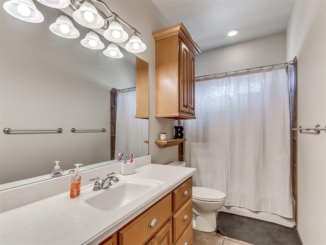 full bathroom with vanity, tile patterned floors, and toilet