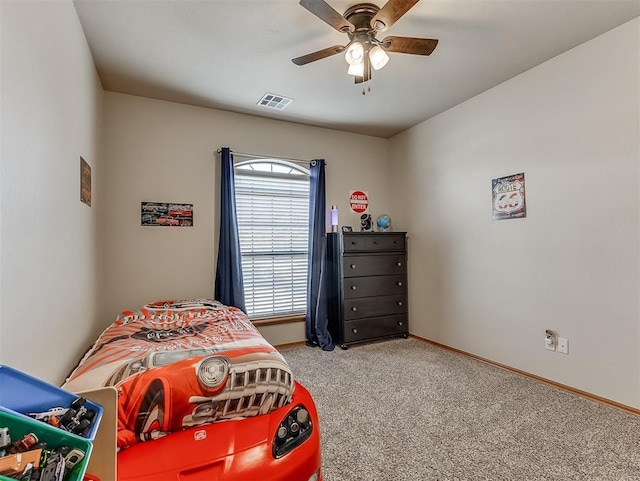 bedroom featuring light carpet, visible vents, a ceiling fan, and baseboards