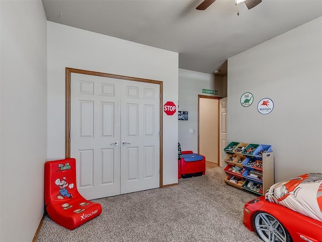 game room with carpet flooring and ceiling fan