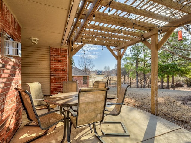 view of patio with outdoor dining space and a pergola