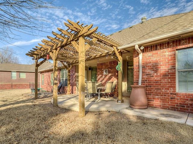 view of patio featuring fence and a pergola