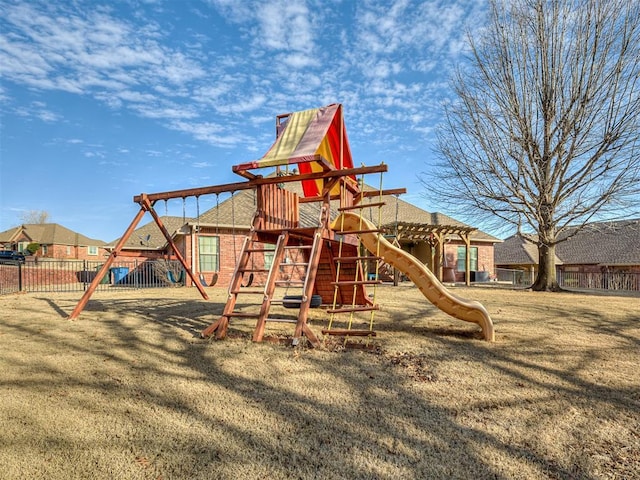 view of play area with a yard and fence