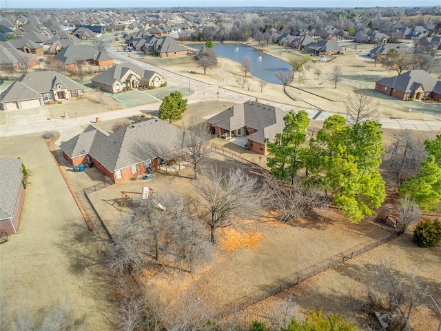 bird's eye view featuring a residential view and a water view