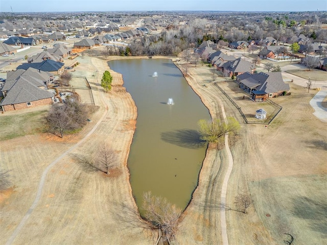 drone / aerial view featuring a residential view and a water view