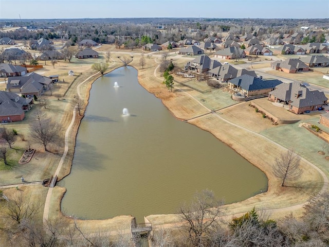 drone / aerial view with a residential view and a water view