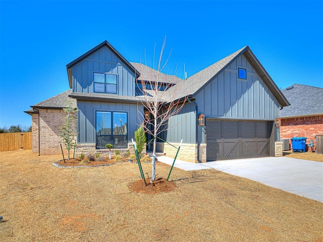 modern inspired farmhouse with cooling unit, driveway, roof with shingles, a garage, and board and batten siding