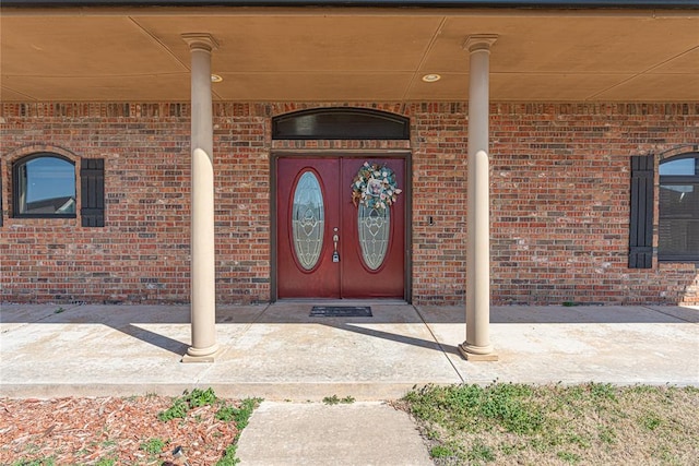 property entrance with brick siding