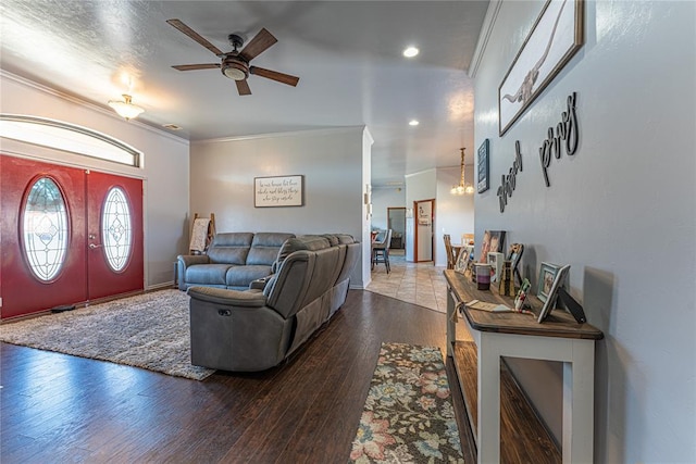 living room featuring recessed lighting, crown molding, a ceiling fan, and wood finished floors