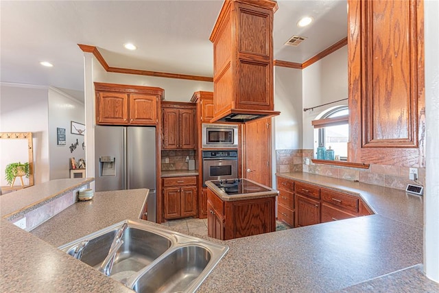 kitchen featuring visible vents, a sink, ornamental molding, stainless steel appliances, and backsplash