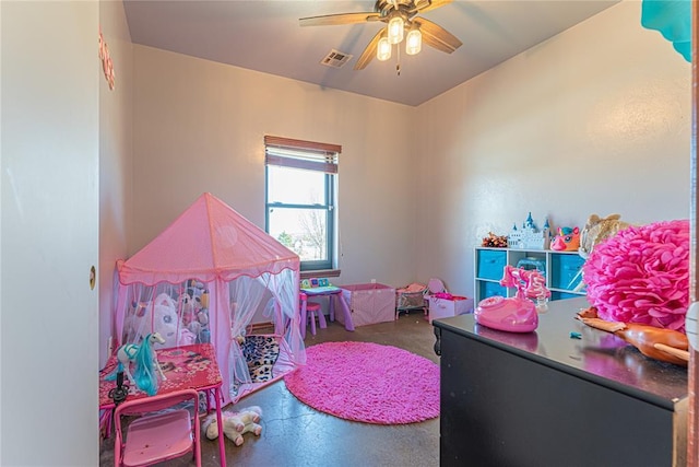 playroom featuring visible vents, concrete flooring, and ceiling fan