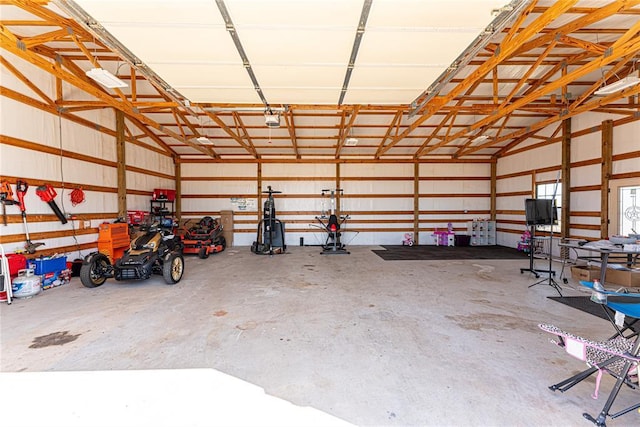 garage with metal wall and a garage door opener