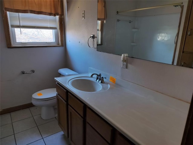 full bathroom with tile patterned floors, toilet, vanity, and walk in shower