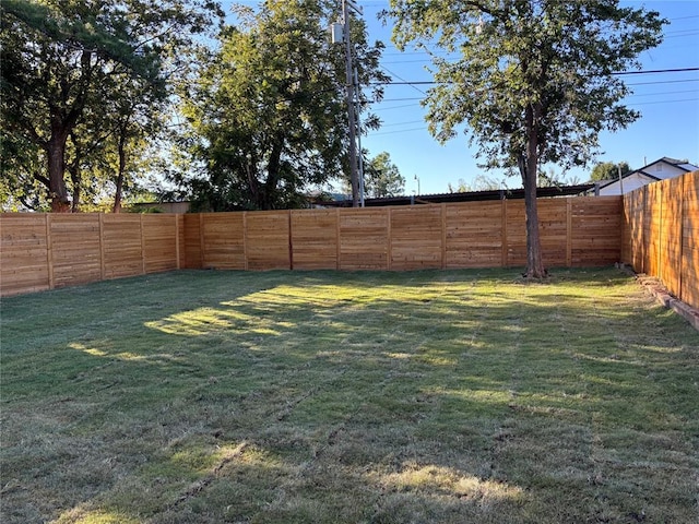 view of yard with a fenced backyard