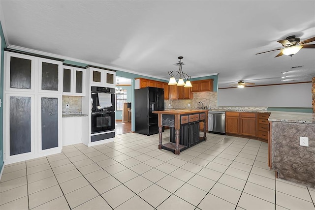 kitchen featuring light tile patterned floors, black appliances, crown molding, and ceiling fan with notable chandelier