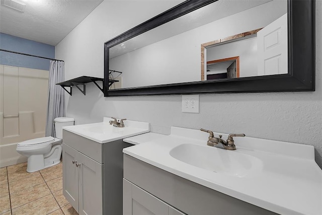 full bath with tile patterned floors, shower / bathtub combination with curtain, toilet, a textured ceiling, and vanity